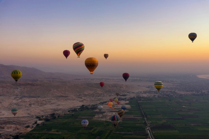 Hot air ballon flying in the sky of Aswan